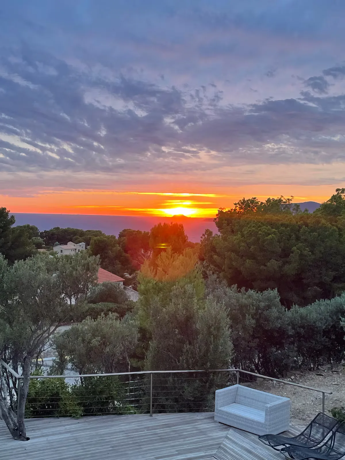 Sunset over the sea seen from the terrace of the Port d'Alon villa